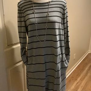 Gray and black stripes swing dress with side pockets.